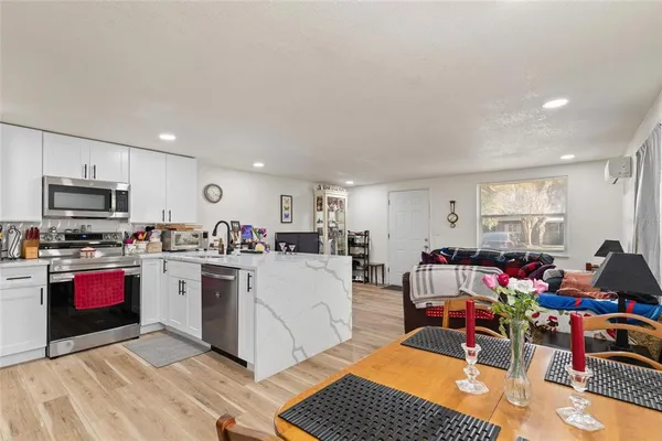 a kitchen with a sink appliances and cabinets