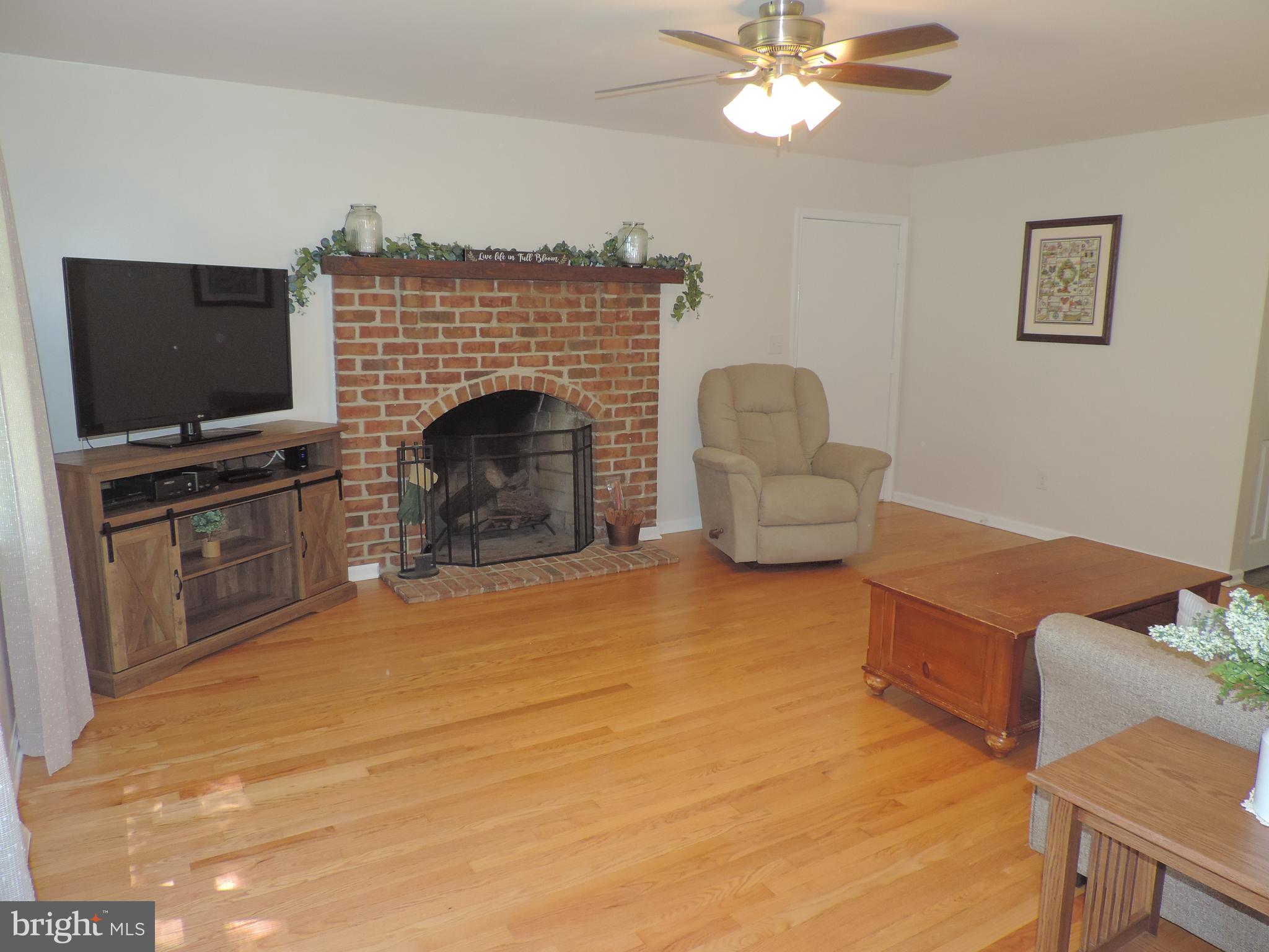 435 Priestford Road Churchville, MD 21028 - Photo 28 of 54 Family Room with fireplace and wood flooring