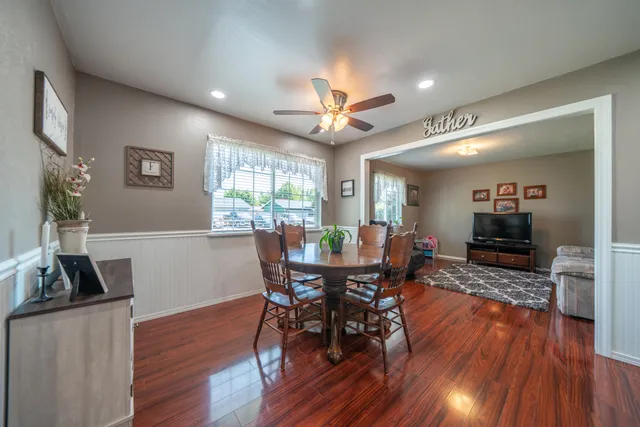 a view of a dining room with furniture window and wooden floor