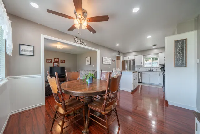 a view of a dining room with furniture and wooden floor