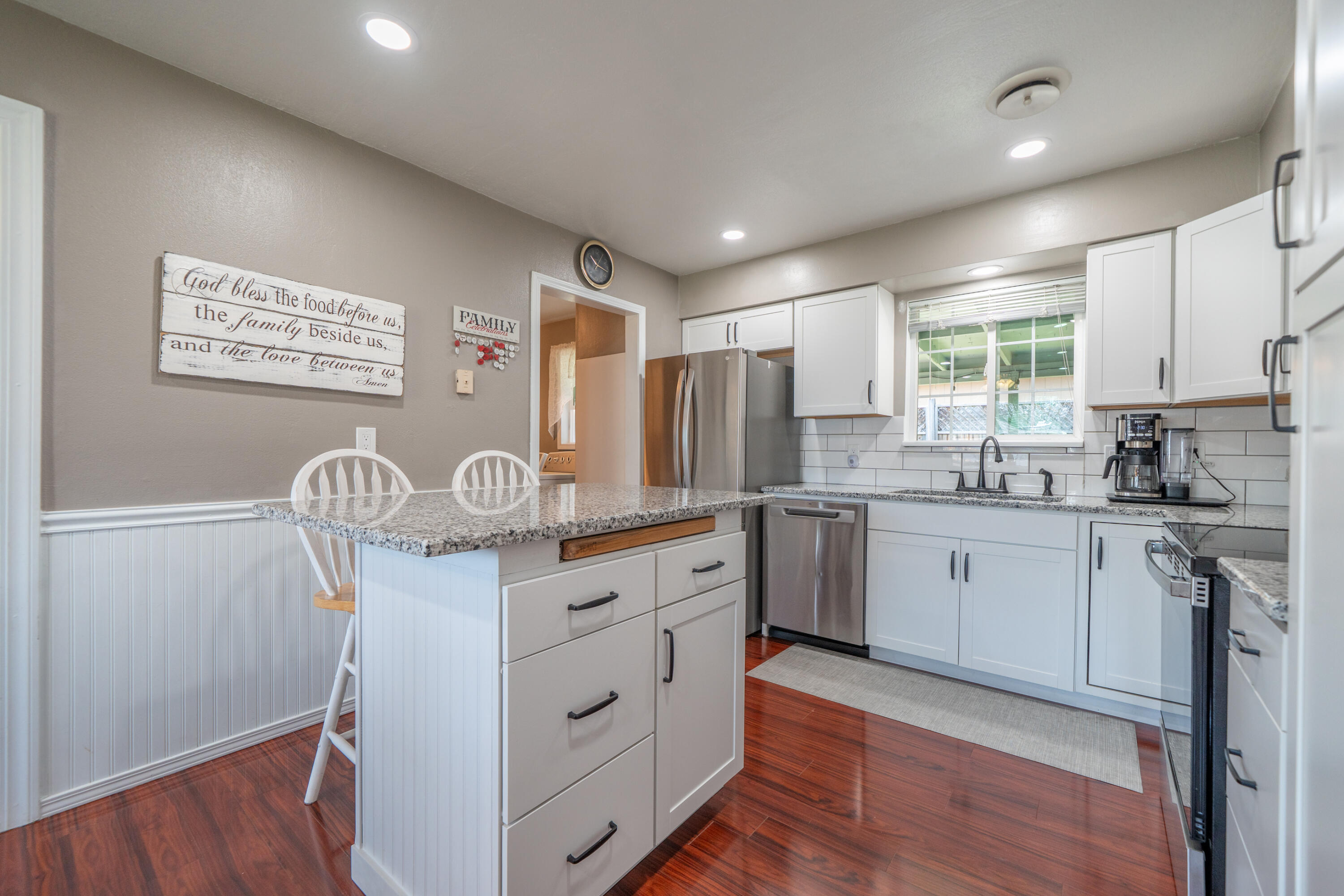 37255 Carson Street Burney, CA 96013 - Photo 15 of 40 a kitchen with granite countertop white cabinets and white appliances