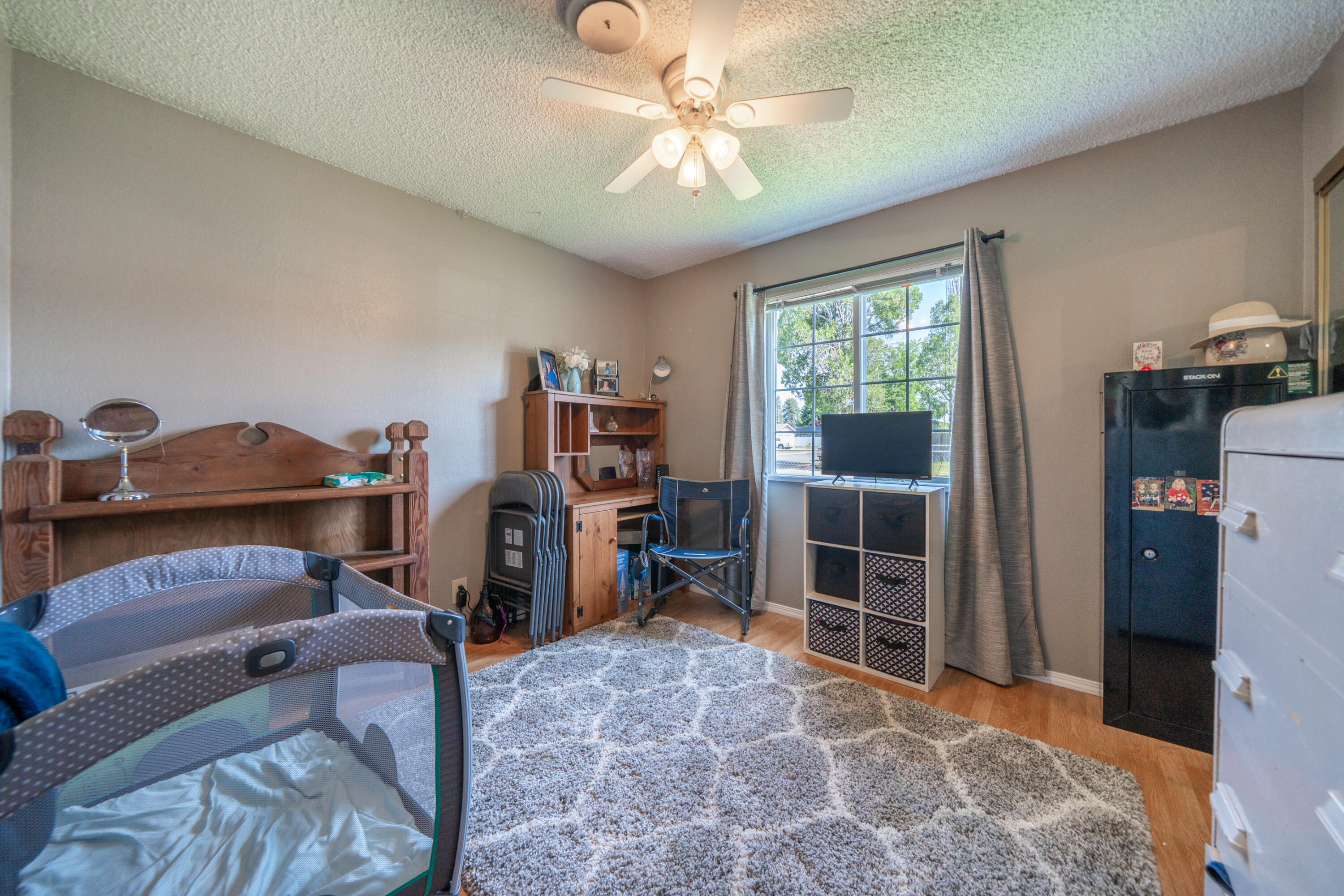 37255 Carson Street Burney, CA 96013 - Photo 24 of 40 a living room with furniture a flat screen tv and gym equipment