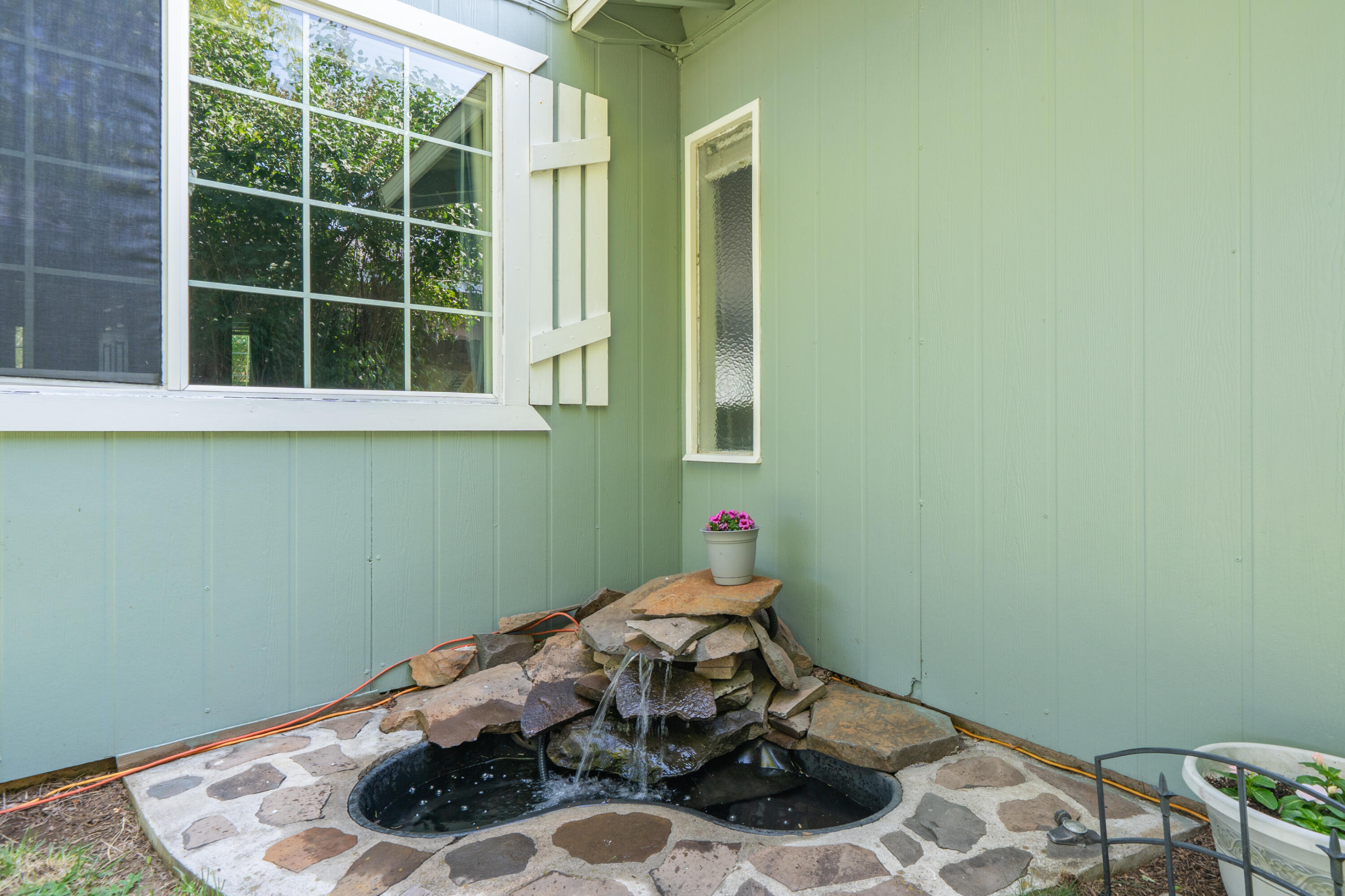 37255 Carson Street Burney, CA 96013 - Photo 35 of 40 a room with a wooden floor and a potted plant
