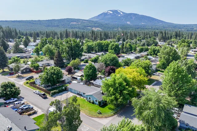 an aerial view of a house with a garden