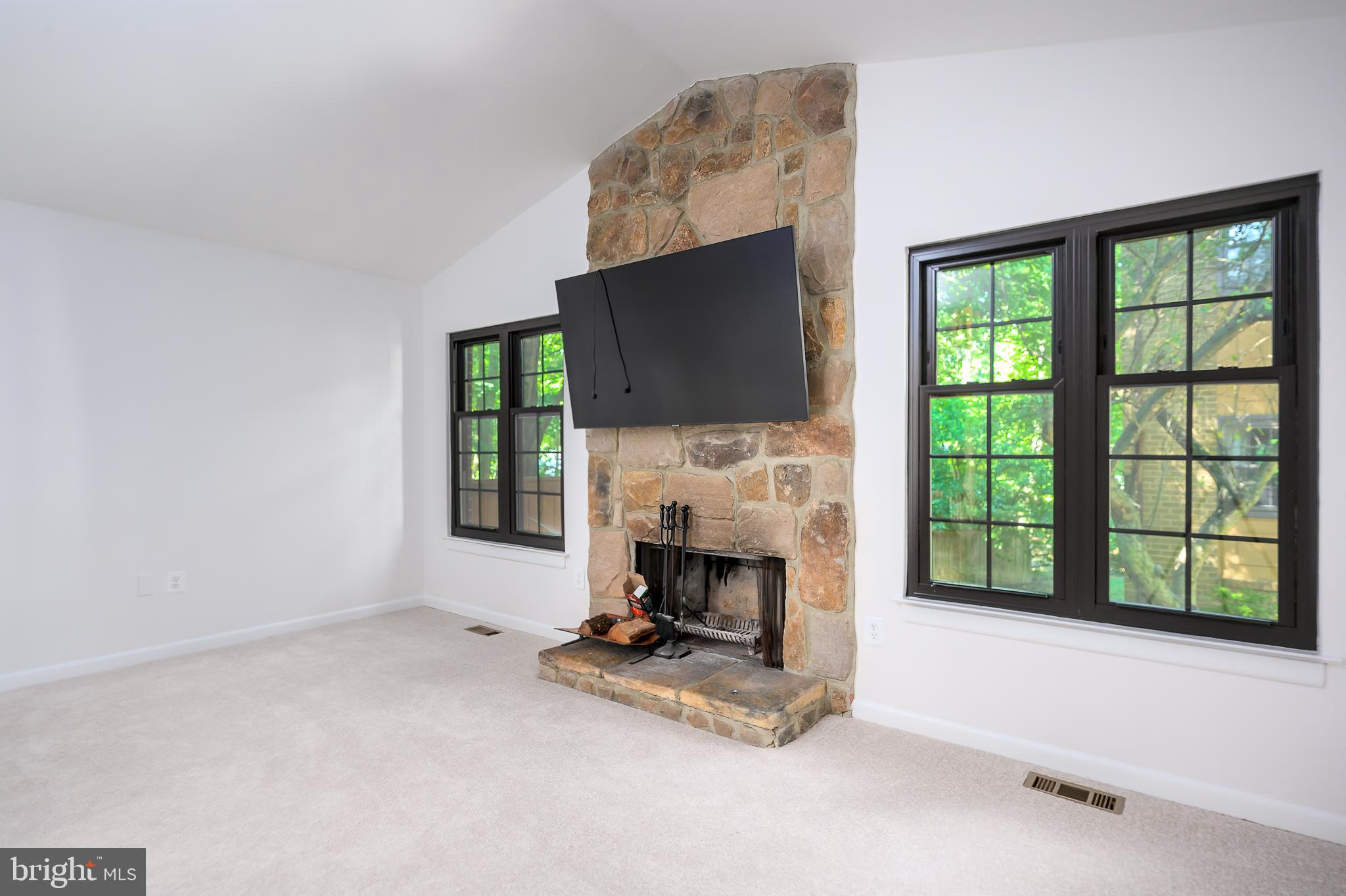 2060 Headlands Circle Reston, VA 20191 - Photo 11 of 26 a living room with a fireplace and a flat screen tv