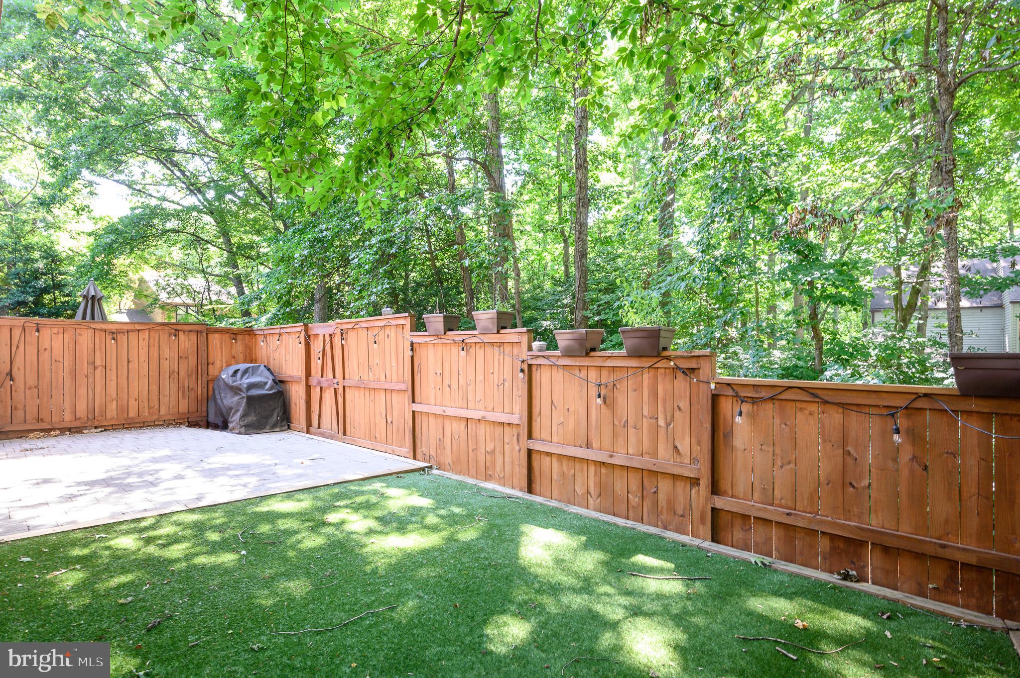 2060 Headlands Circle Reston, VA 20191 - Photo 20 of 26 a view of a backyard with wooden fence