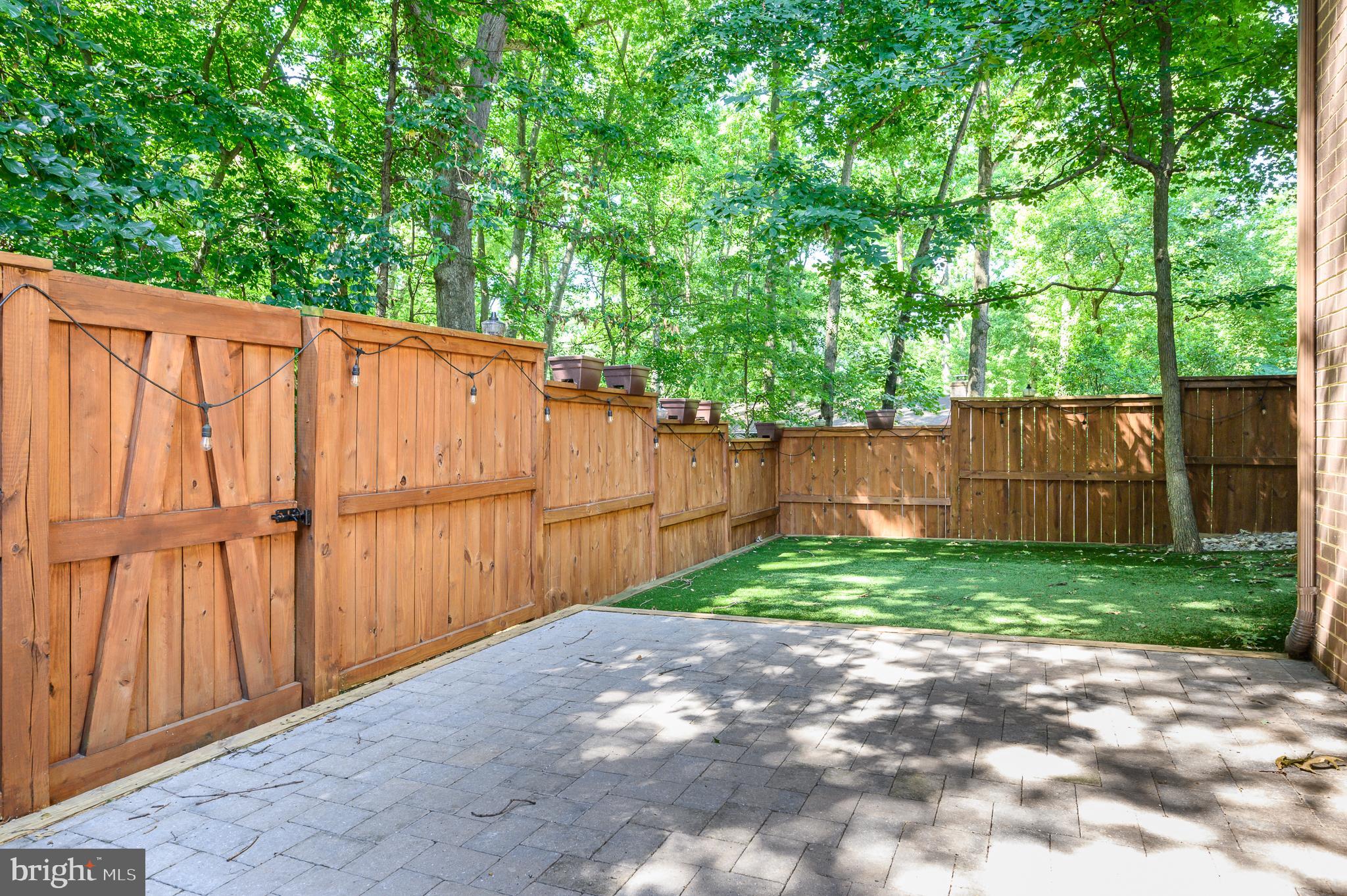 2060 Headlands Circle Reston, VA 20191 - Photo 21 of 26 a view of backyard with green space and wooden fence