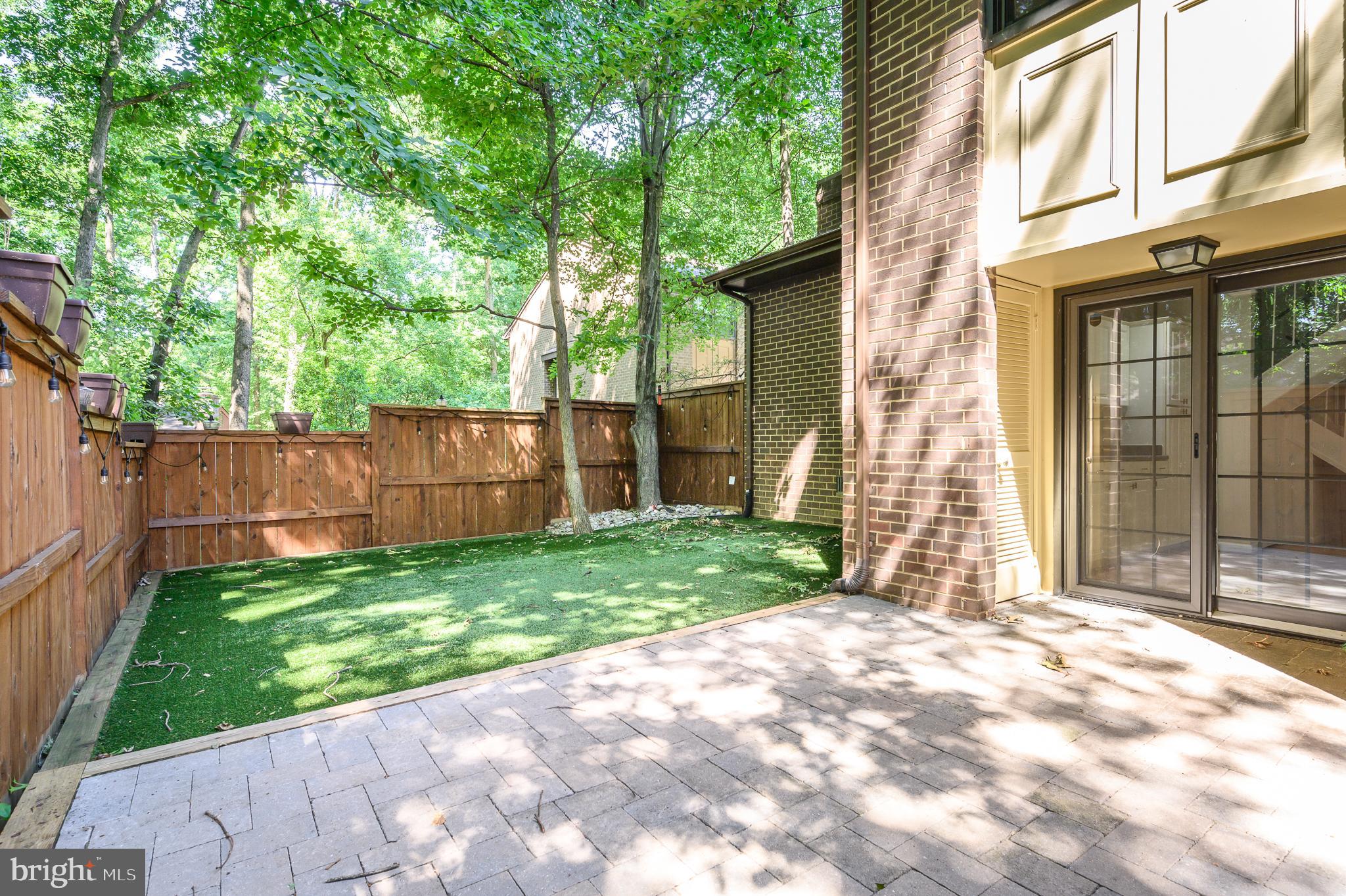 2060 Headlands Circle Reston, VA 20191 - Photo 22 of 26 a view of a house with a small yard and a large tree