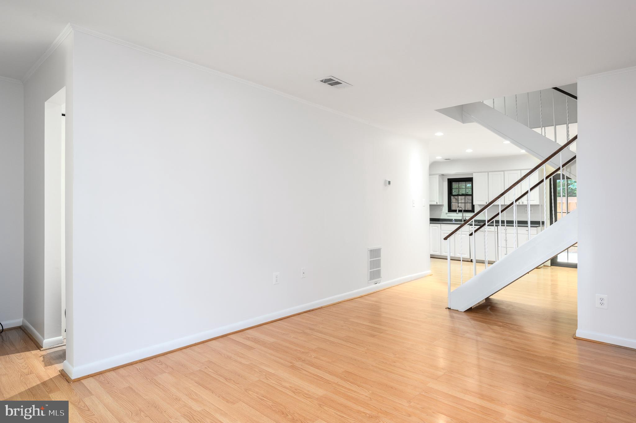 2060 Headlands Circle Reston, VA 20191 - Photo 4 of 26 a view of entryway and hall with wooden floor