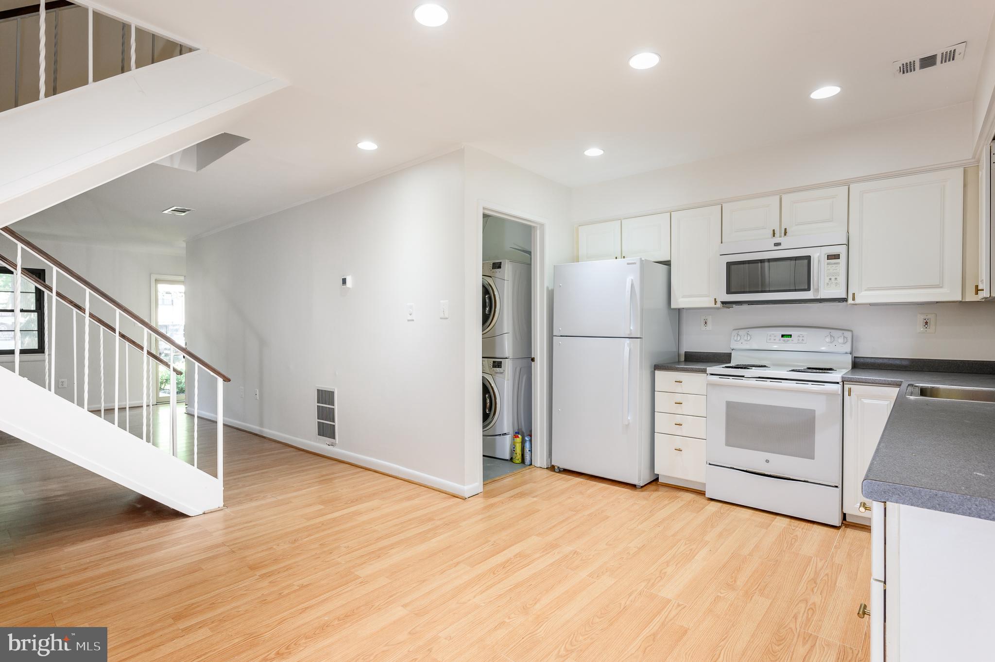 2060 Headlands Circle Reston, VA 20191 - Photo 8 of 26 a kitchen with stainless steel appliances a refrigerator and a stove top oven