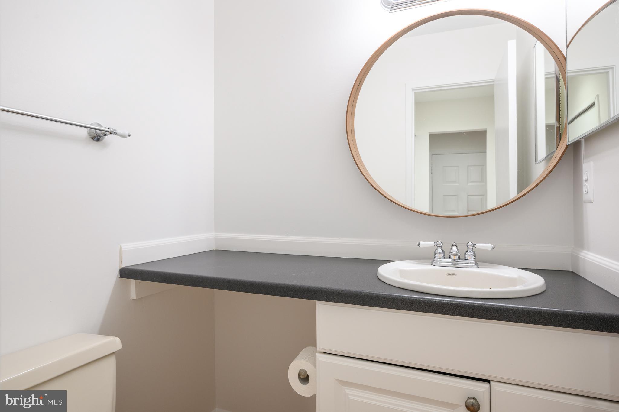 2060 Headlands Circle Reston, VA 20191 - Photo 10 of 26 a bathroom with a sink a mirror and a toilet