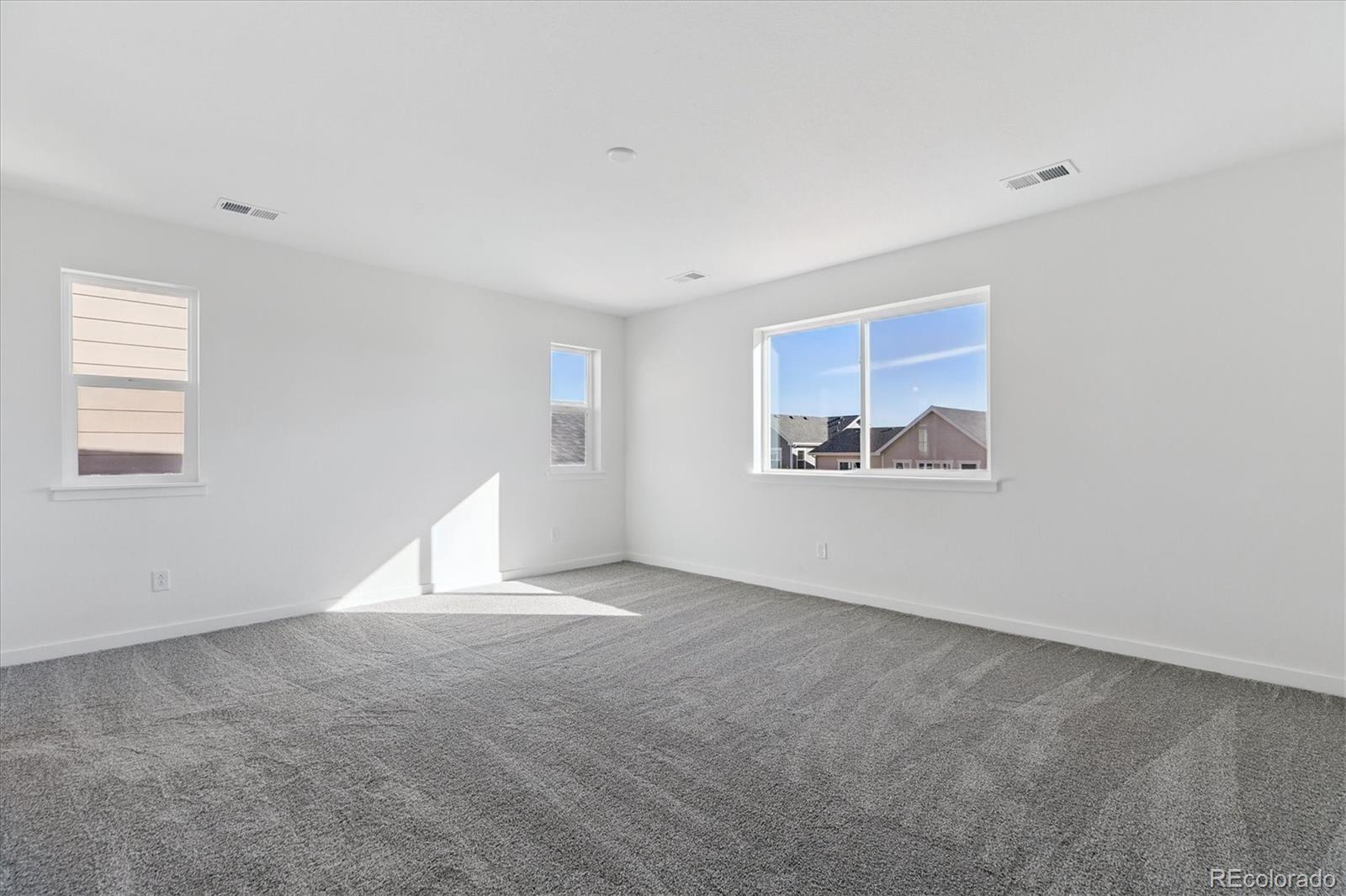 2572 West Bitterroot Place Highlands Ranch, CO 80129 - Photo 16 of 30 an empty room with windows