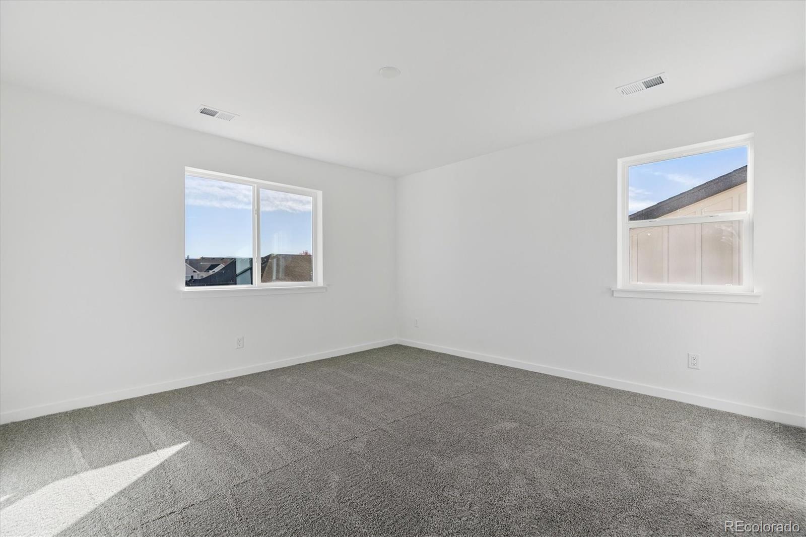 2572 West Bitterroot Place Highlands Ranch, CO 80129 - Photo 18 of 30 an empty room with a window
