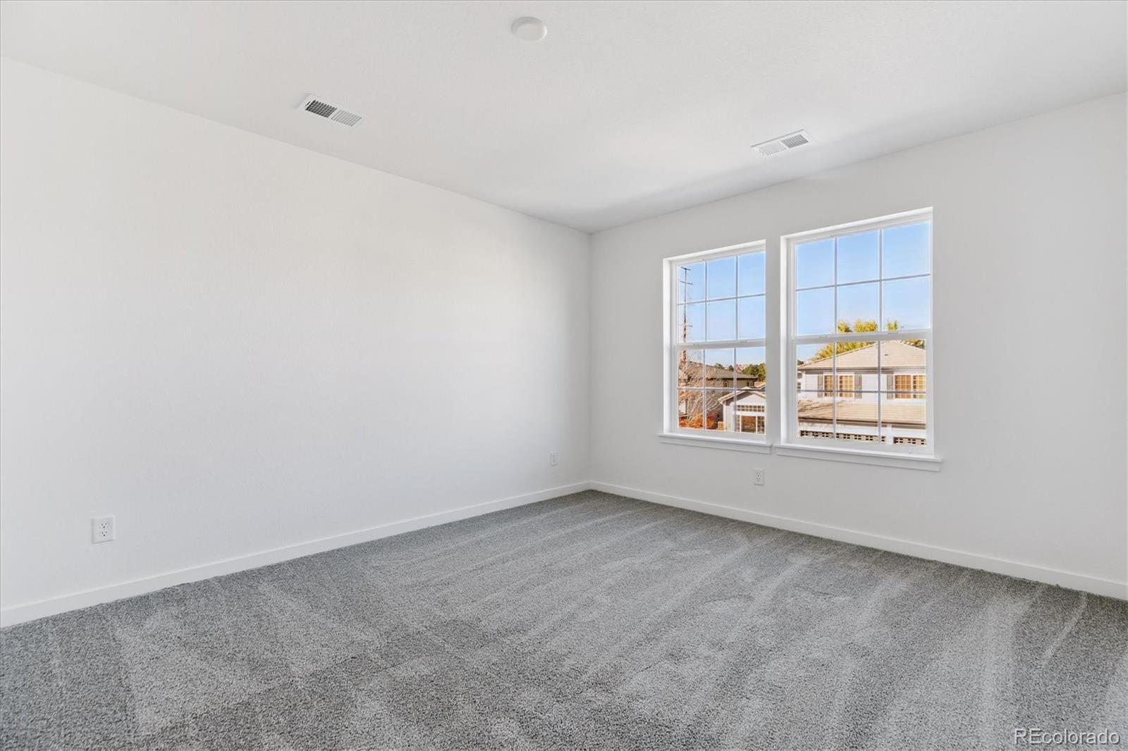 2572 West Bitterroot Place Highlands Ranch, CO 80129 - Photo 20 of 30 an empty room with windows