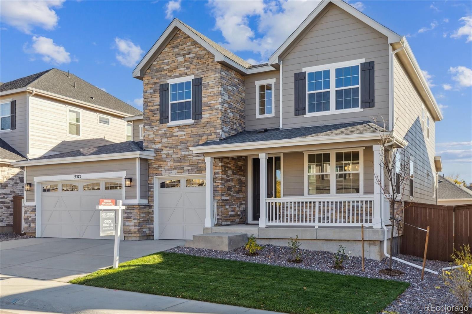 2572 West Bitterroot Place Highlands Ranch, CO 80129 - Photo 2 of 30 front view of a house with a yard