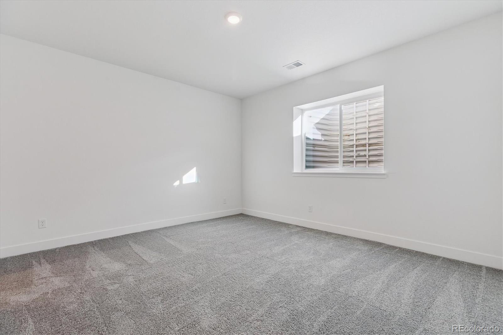 2572 West Bitterroot Place Highlands Ranch, CO 80129 - Photo 25 of 30 an empty room with a window