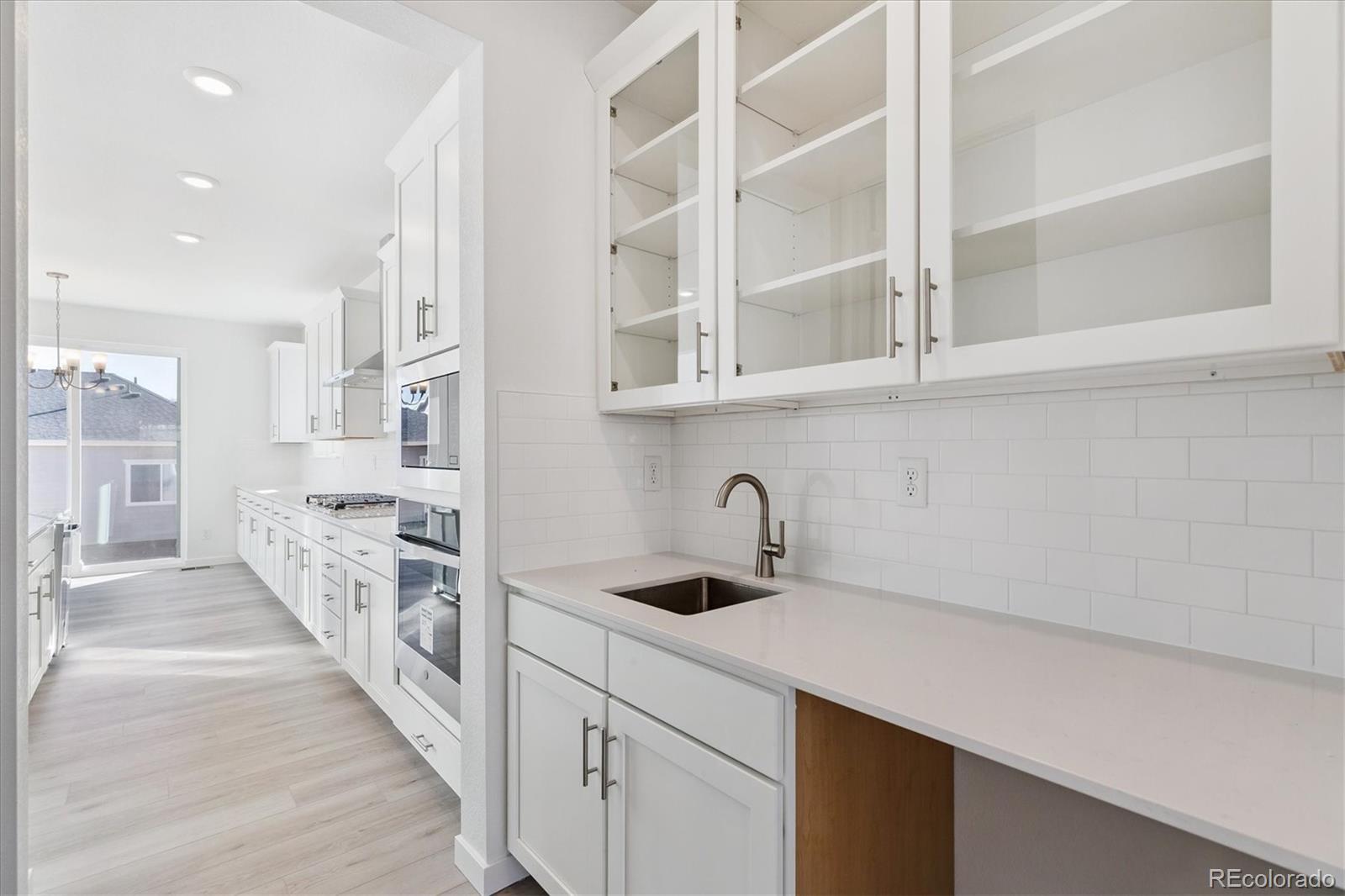 2572 West Bitterroot Place Highlands Ranch, CO 80129 - Photo 6 of 30 a view of a kitchen with a sink