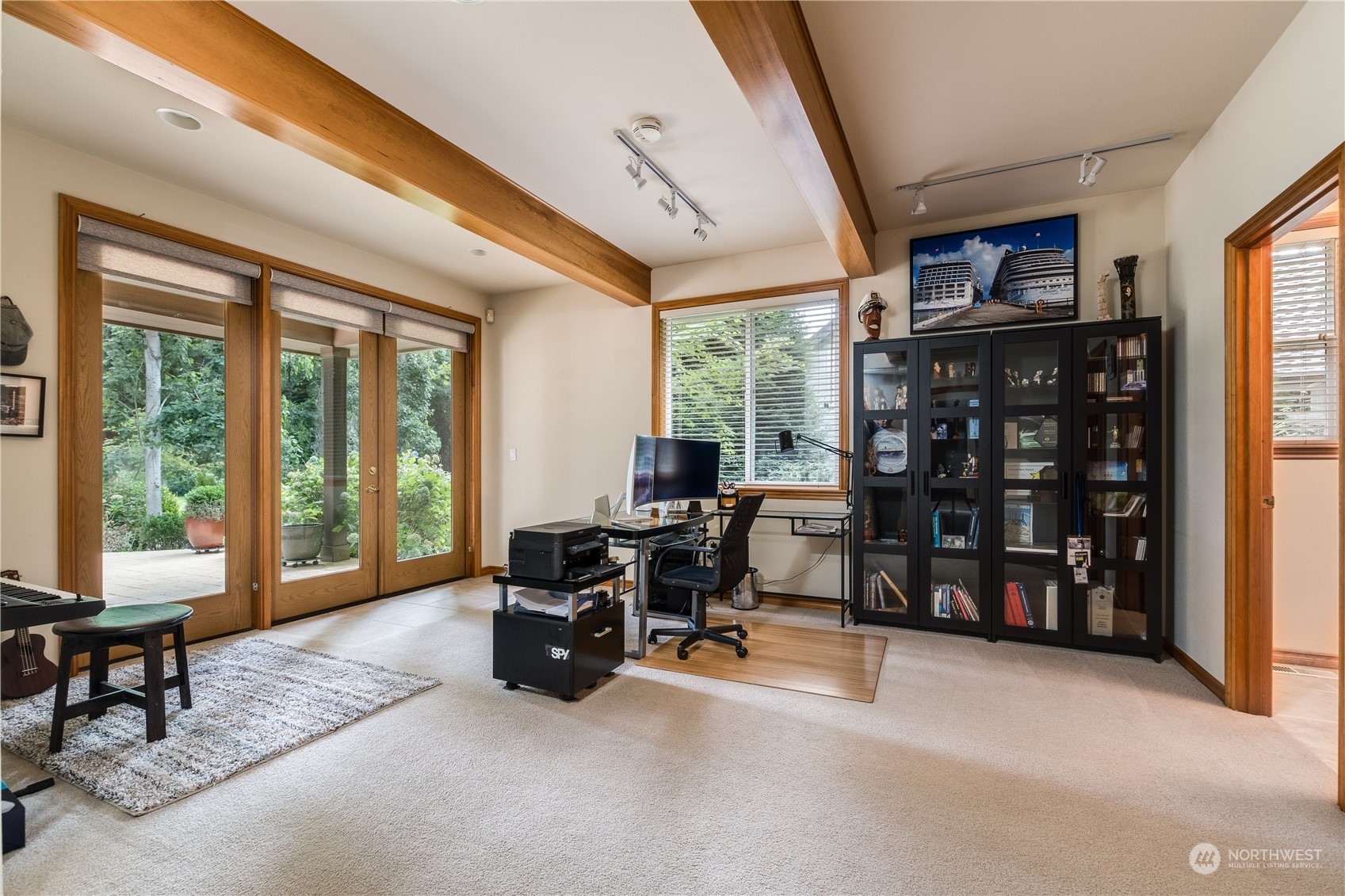 5447 Canvasback Road Blaine, WA 98230 - Photo 12 of 40 a living room with furniture a large window and book shelf