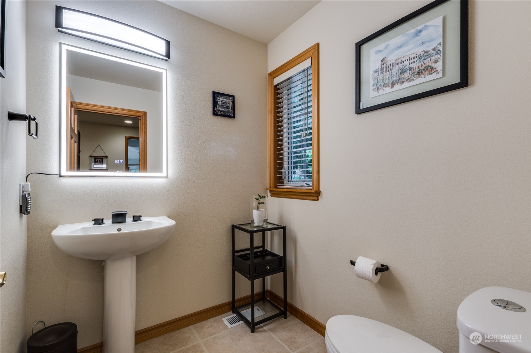 5447 Canvasback Road Blaine, WA 98230 - Photo 14 of 40 a bathroom with a sink mirror and toilet