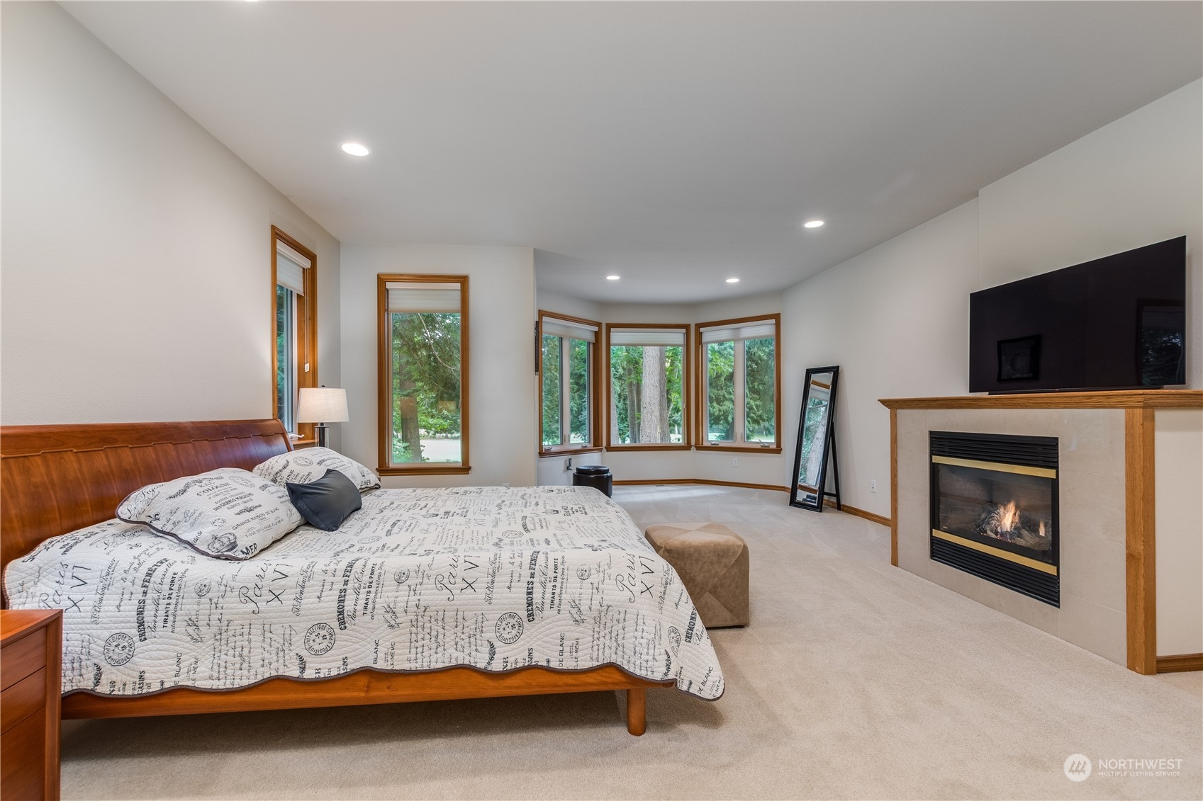 5447 Canvasback Road Blaine, WA 98230 - Photo 17 of 40 a bedroom with a large bed and a flat screen tv