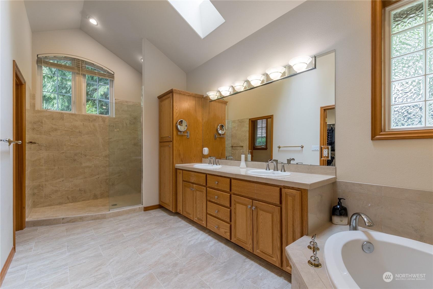 5447 Canvasback Road Blaine, WA 98230 - Photo 21 of 40 a bathroom with a double vanity sink mirror and shower