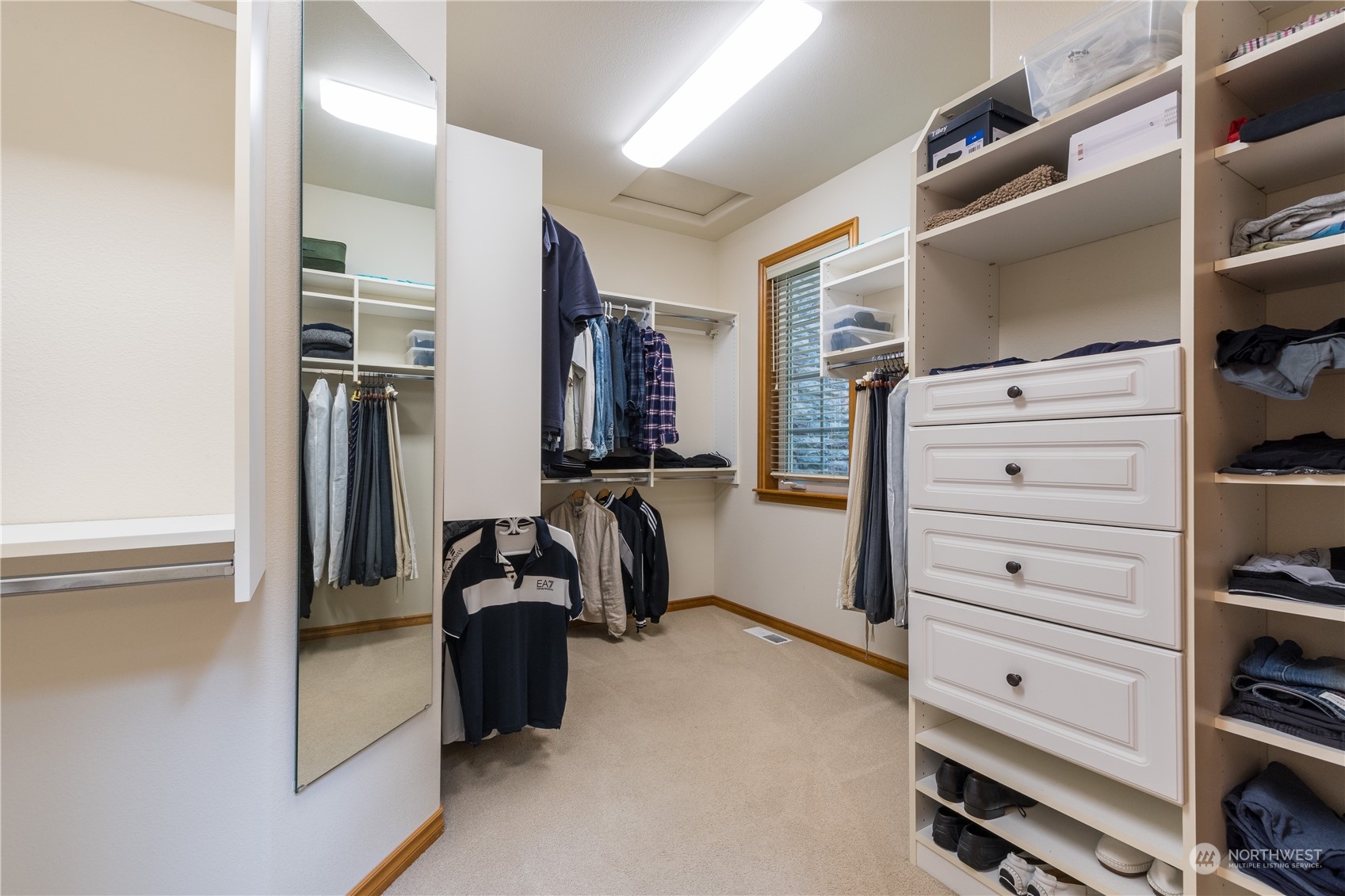 5447 Canvasback Road Blaine, WA 98230 - Photo 22 of 40 a view of walk in closet with clothes and shoes