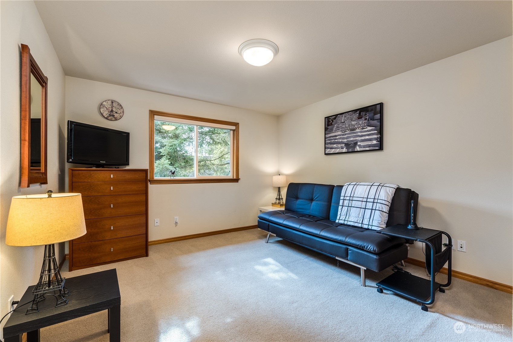 5447 Canvasback Road Blaine, WA 98230 - Photo 26 of 40 a living room with furniture and a flat screen tv