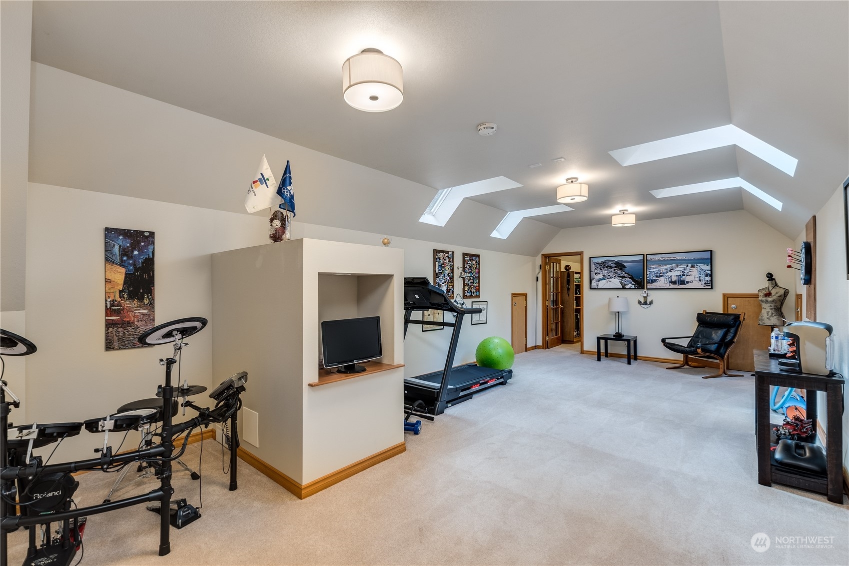5447 Canvasback Road Blaine, WA 98230 - Photo 28 of 40 a view of a livingroom with furniture and a gym cycle