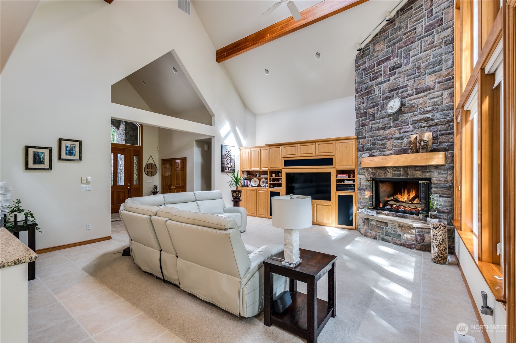 5447 Canvasback Road Blaine, WA 98230 - Photo 6 of 40 a living room with furniture and a fireplace