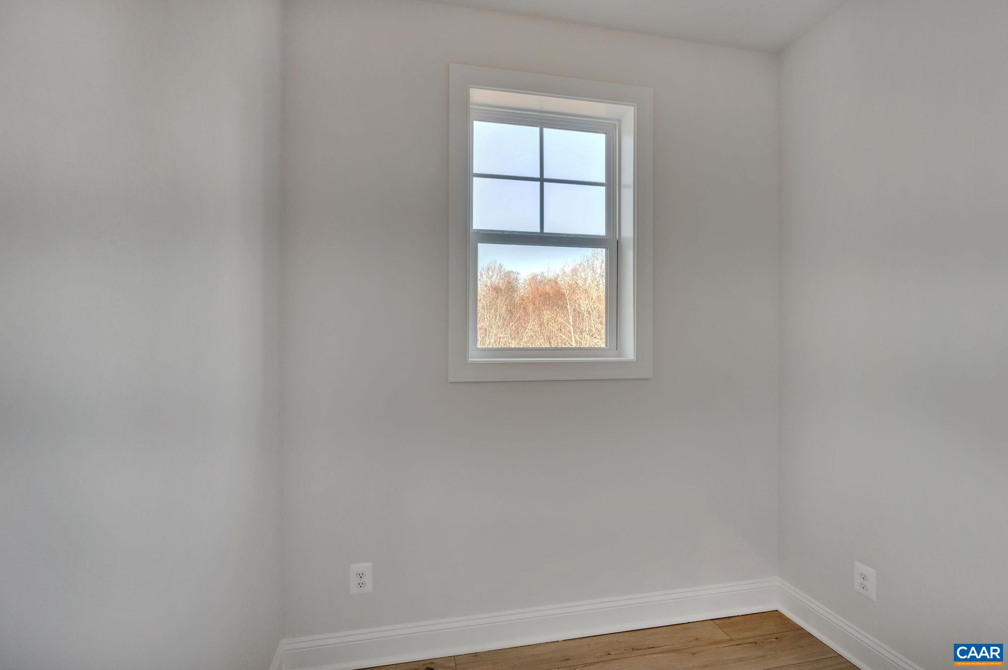 109 B Marcella Street Charlottesville, VA 22911 - Photo 18 of 36 an empty room with a window