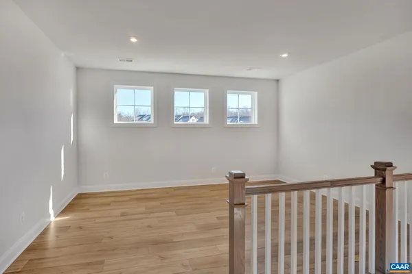 a view of entryway with wooden floor
