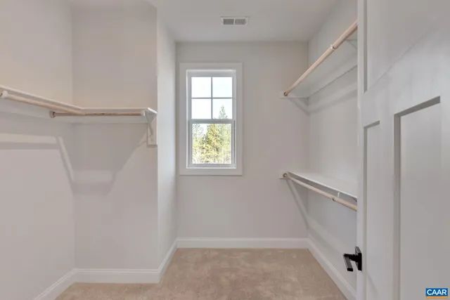 a view of walk in closet with window