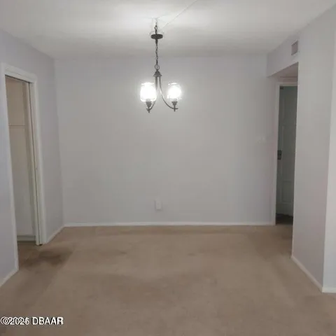 a kitchen with white cabinets sink and stainless steel appliances