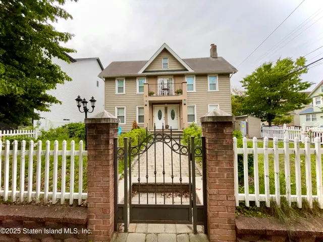 a front view of a house with a porch