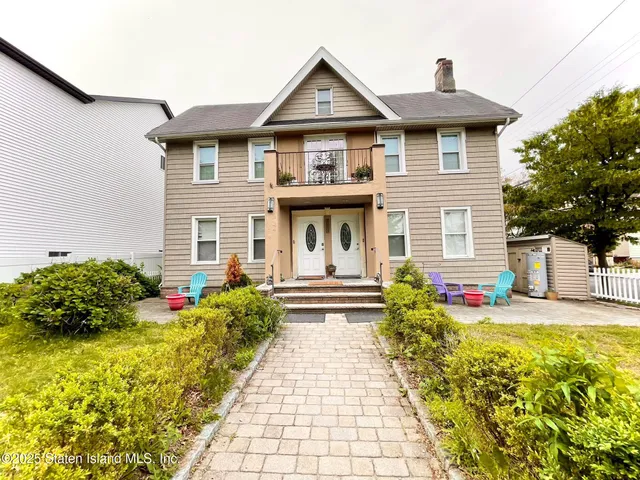 a front view of a house with entertaining space