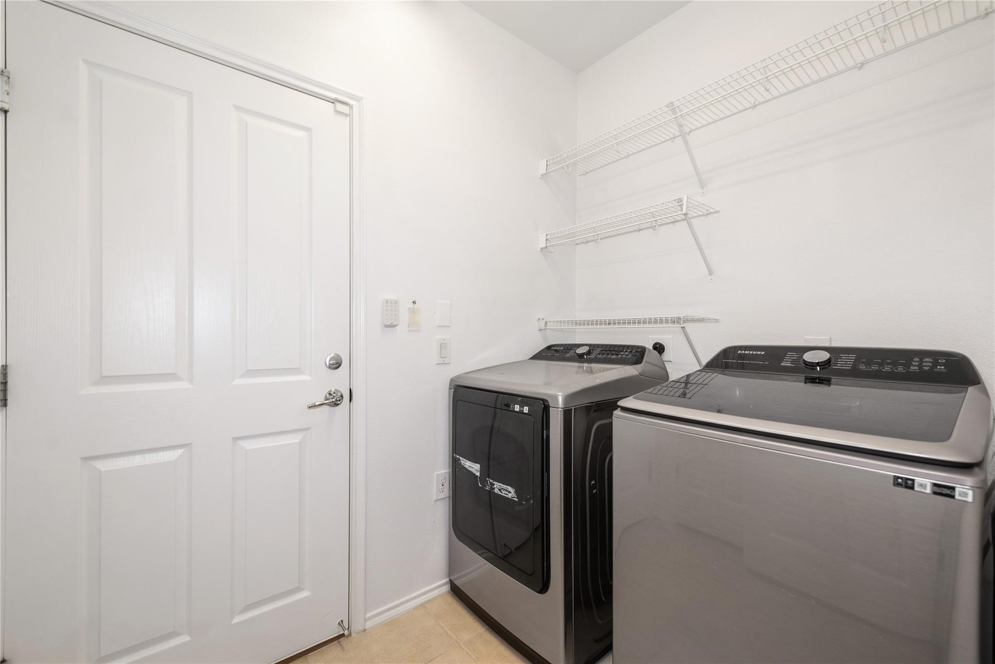 13600 Breton Ridge Street, Unit 24A Houston, TX 77070 - Photo 17 of 24 a utility room with dryer and washer