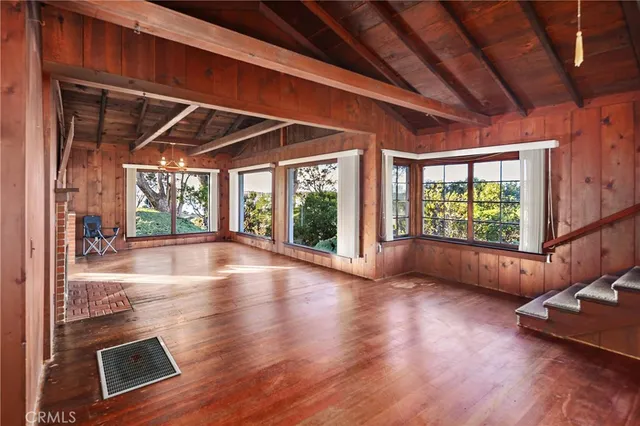 a view of an entryway with wooden floor