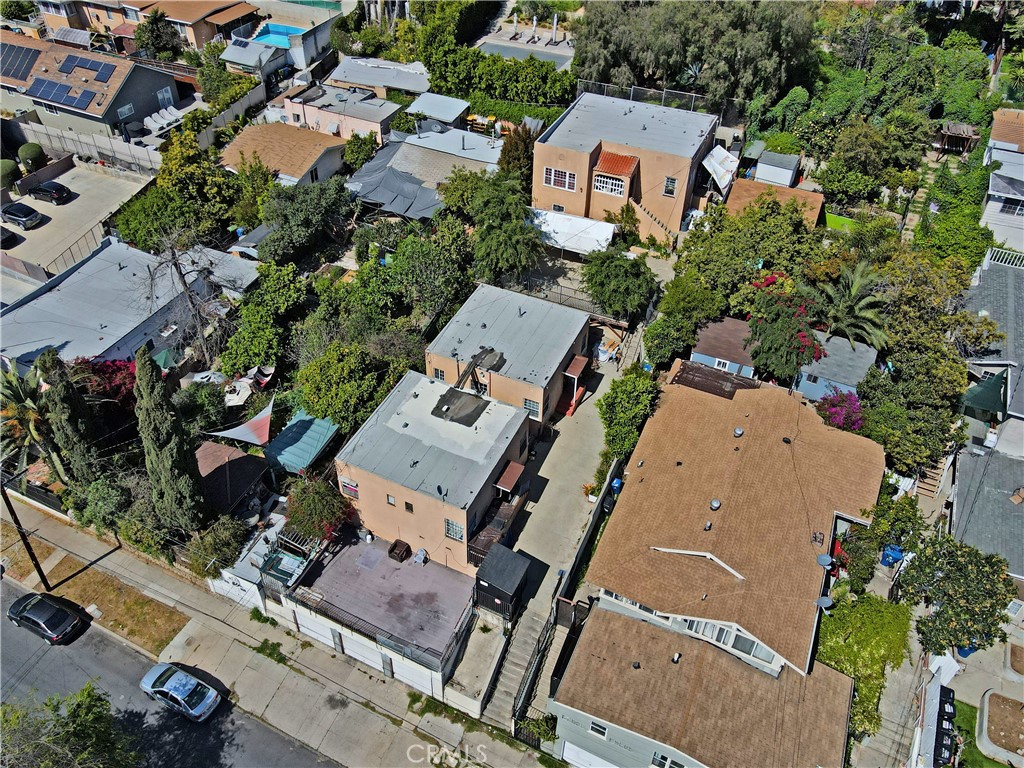 an aerial view of a house with a yard