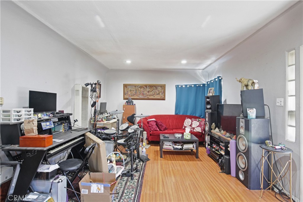 2001 Berkeley Avenue Los Angeles, CA 90026 - Photo 13 of 40 a living room with furniture a flat screen tv and a dining table