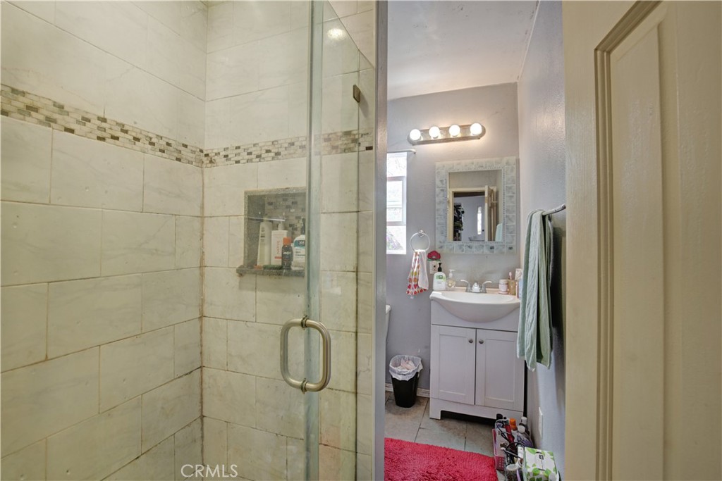 2001 Berkeley Avenue Los Angeles, CA 90026 - Photo 17 of 40 a bathroom with a sink mirror and shower