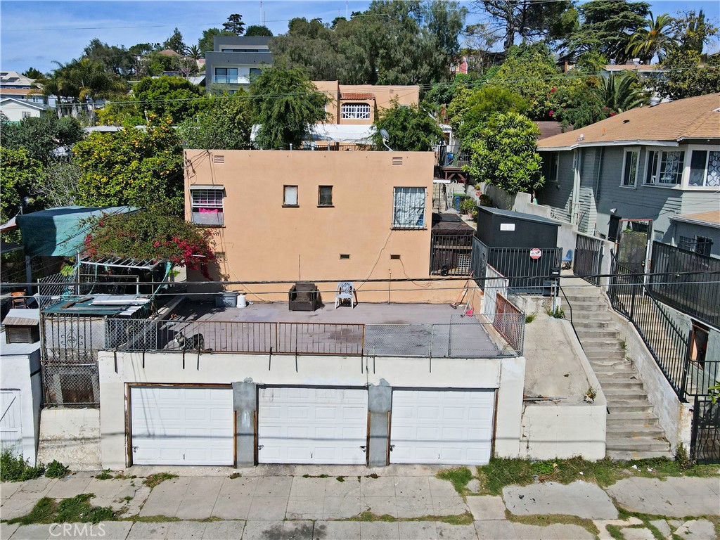 2001 Berkeley Avenue Los Angeles, CA 90026 - Photo 24 of 40 a view of a patio with table and chairs a barbeque and potted plants