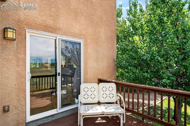 a view of a balcony with wooden floor