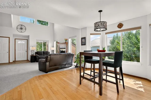a view of a dining room with furniture window and wooden floor
