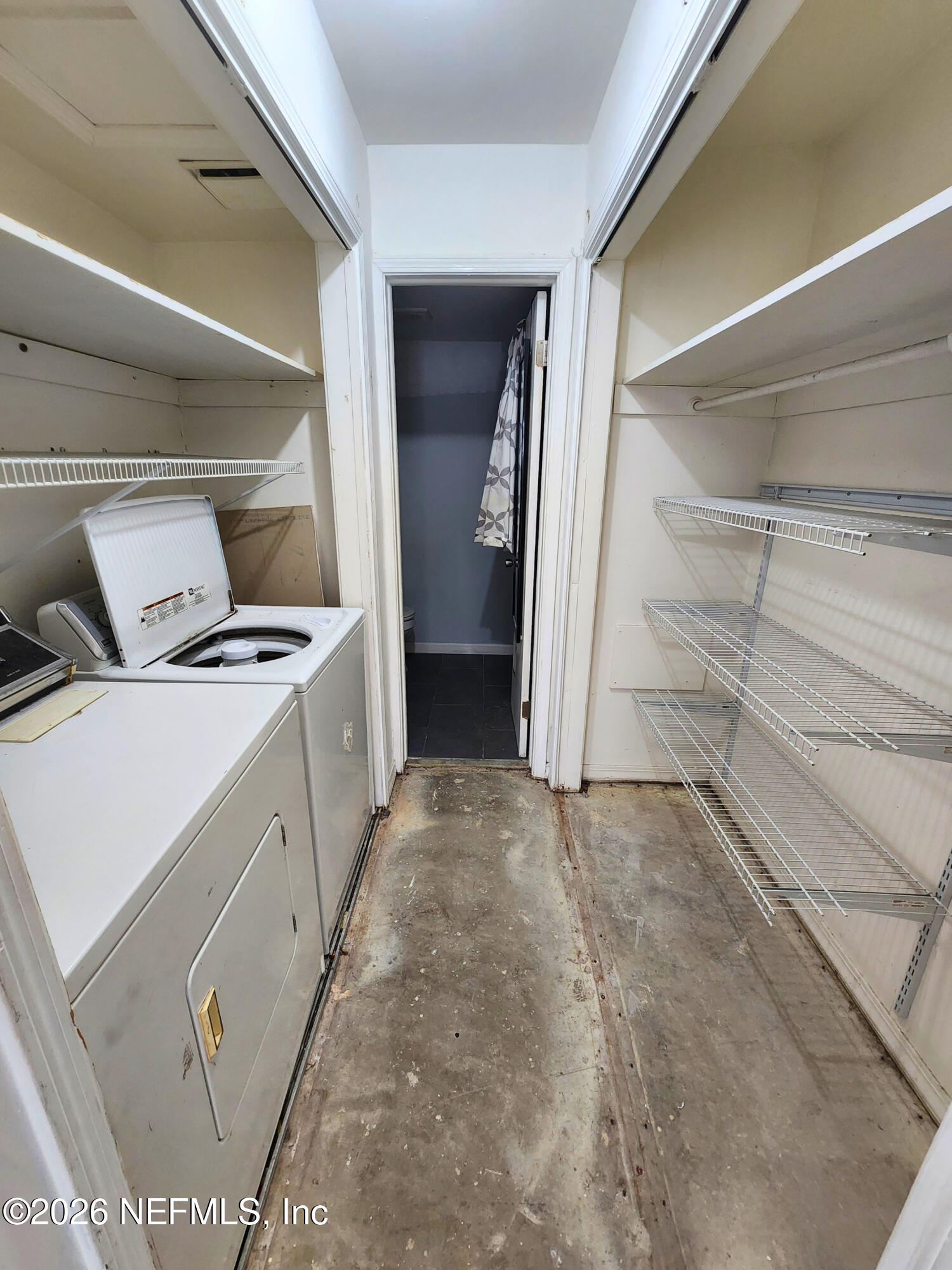 1716 El Camino Road, Unit 1 Jacksonville, FL 32216 - Photo 12 of 15 a view of storage and utility room with washer and dryer
