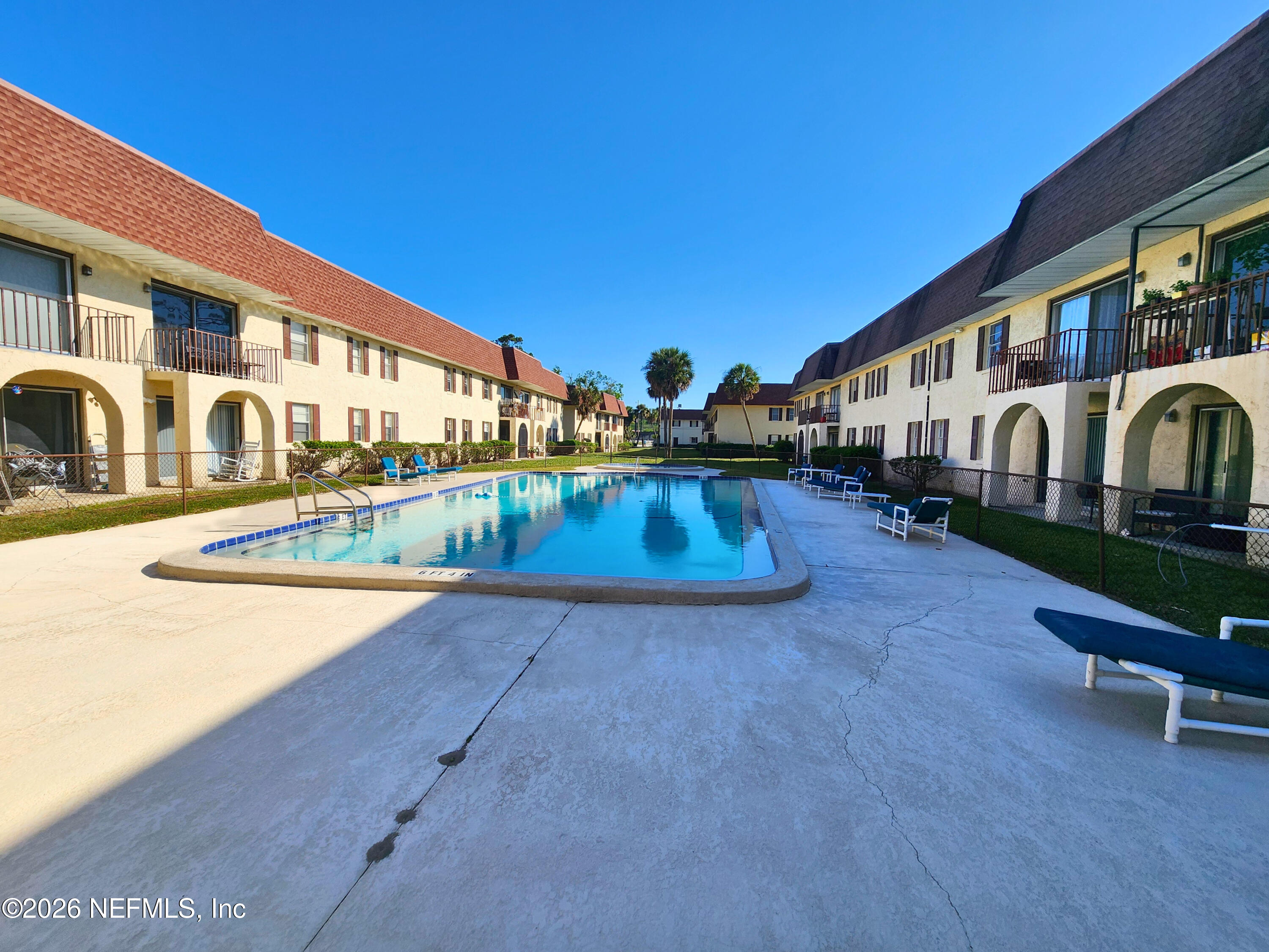 1716 El Camino Road, Unit 1 Jacksonville, FL 32216 - Photo 15 of 15 a view of a house with swimming pool and sitting area