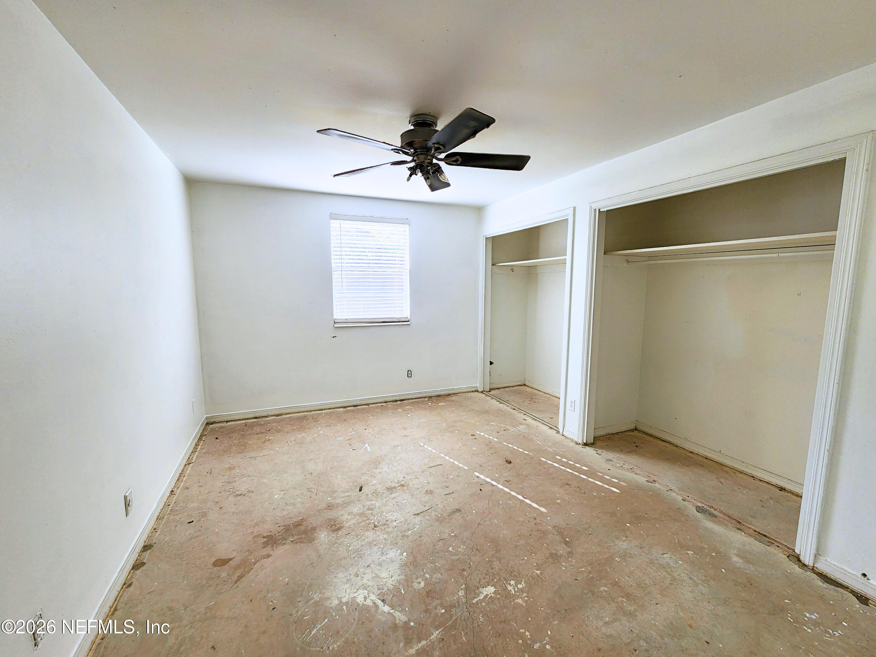 1716 El Camino Road, Unit 1 Jacksonville, FL 32216 - Photo 10 of 15 an empty room with windows and ceiling fan