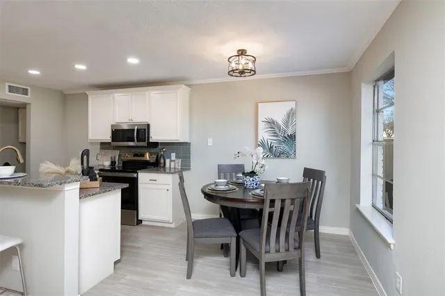 a view of a dining room with furniture