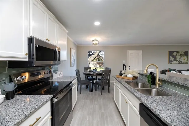 a kitchen with granite countertop lots of counter top space