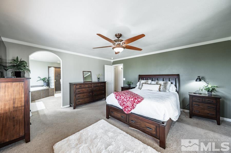 200 Antelope Valley Road Reno, NV 89506 - Photo 15 of 28 a bedroom with a bed and a chandelier