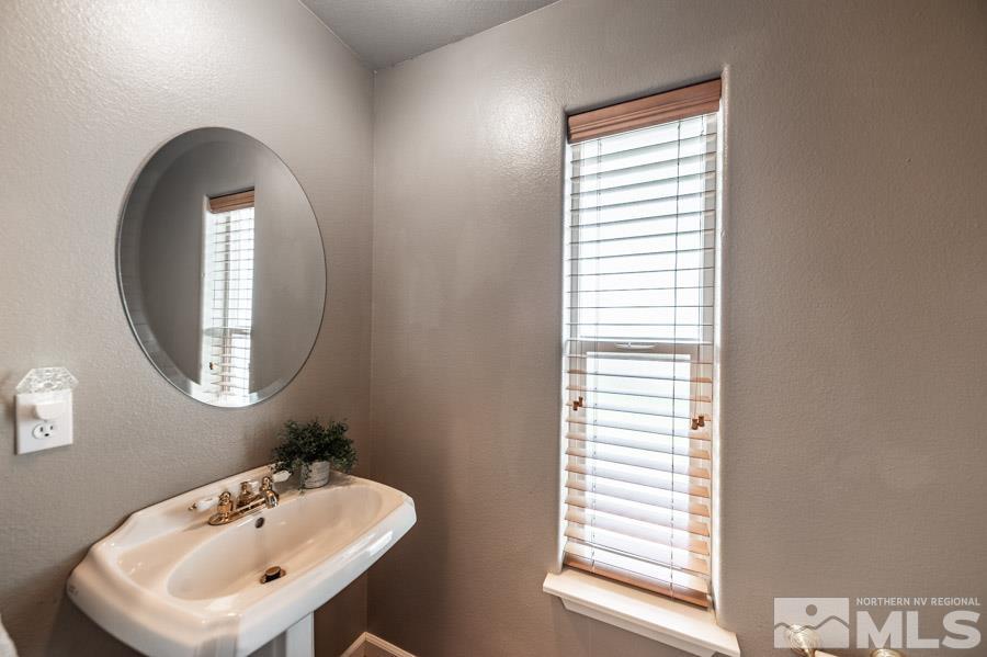 200 Antelope Valley Road Reno, NV 89506 - Photo 20 of 28 a bathroom with a sink a mirror and a window